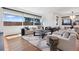 Bright living room with neutral-toned furniture, large windows, and hardwood floors, with modern accents at 267 S Clermont St, Denver, CO 80246