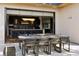 Covered patio with outdoor dining and direct access to kitchen through sliding glass doors at 267 S Clermont St, Denver, CO 80246