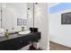 Stylish powder room featuring modern fixtures, unique lighting, and designer mirror at 267 S Clermont St, Denver, CO 80246