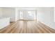 Bright and spacious living room features hardwood floors and large windows for ample natural light at 9283 Biscay St, Commerce City, CO 80022