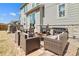 Inviting backyard space complete with a fire pit, outdoor seating, and grilling area at 840 Avena Dr, Elizabeth, CO 80107