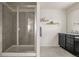 Bathroom featuring a glass enclosed shower, granite counters and stylish vanity at 840 Avena Dr, Elizabeth, CO 80107