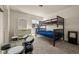 Bedroom showcasing a bunkbed and drumset, with neutral walls, and bright natural light at 840 Avena Dr, Elizabeth, CO 80107