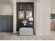 Stylish entryway features dark accent wall, light wood floors, and modern lighting at 840 Avena Dr, Elizabeth, CO 80107