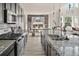 Open kitchen features granite countertops, stainless steel appliances and views to a dining area and seating area at 840 Avena Dr, Elizabeth, CO 80107