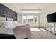 Spacious main bedroom with bright natural light, tray ceiling and modern furnishings at 840 Avena Dr, Elizabeth, CO 80107