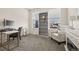 Bright and airy office area, complete with desk, chair, bookshelf and an inviting armchair at 840 Avena Dr, Elizabeth, CO 80107