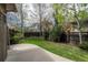 Well-maintained backyard with lush lawn, privacy fence, concrete patio, and mature landscaping at 9266 E 35Th Ave, Denver, CO 80238