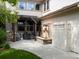 Backyard patio featuring a water feature, outdoor seating, and adjacent dining area, great for entertaining at 9266 E 35Th Ave, Denver, CO 80238