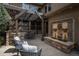 Outdoor patio area with water feature and pergola, ideal for relaxing and entertaining at 9266 E 35Th Ave, Denver, CO 80238