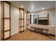 Basement featuring decorative lighting, comfortable seating, and a large TV, perfect for relaxing at 9266 E 35Th Ave, Denver, CO 80238