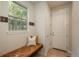 Cozy entryway with a built-in bench, natural light, and convenient coat hooks at 9266 E 35Th Ave, Denver, CO 80238