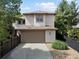 Charming two-story home with a two-car garage and well-maintained front yard at 9266 E 35Th Ave, Denver, CO 80238