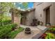 Inviting front entrance with stone accents, decorative plants, and a charming water fountain at 9266 E 35Th Ave, Denver, CO 80238