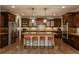 Gourmet kitchen with stainless steel appliances, granite countertops, and a center island with seating at 9266 E 35Th Ave, Denver, CO 80238