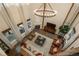 Stunning living room with soaring ceilings, a modern chandelier, and an elegant fireplace at 9266 E 35Th Ave, Denver, CO 80238