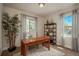 Bright home office with a wooden desk, shelving unit, and large windows with natural light at 9266 E 35Th Ave, Denver, CO 80238
