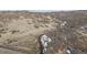 Long, winding driveway leading to a secluded home nestled in a natural landscape at 1140 Lake Gulch Rd, Castle Rock, CO 80104