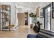 Bright entryway featuring light wood floors, designer console table, and artistic wall decor at 1140 Lake Gulch Rd, Castle Rock, CO 80104