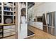 Elegant kitchen with stainless steel appliances and a walk-in wine cellar at 1140 Lake Gulch Rd, Castle Rock, CO 80104