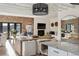 Bright living room features brick accent wall, herringbone floors, modern lighting, fireplace, and comfortable seating at 1140 Lake Gulch Rd, Castle Rock, CO 80104