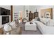 Cozy living room boasts a fireplace, stylish bookshelves, and comfortable seating area at 1140 Lake Gulch Rd, Castle Rock, CO 80104