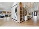 Spacious living room with a large artistic horse painting and Herringbone-style floors at 1140 Lake Gulch Rd, Castle Rock, CO 80104