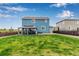 Spacious, fenced backyard with an outdoor gazebo and ample green space at 10 N Quantock St, Aurora, CO 80018