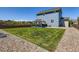 Large backyard featuring a well-maintained lawn, a patio, and an outdoor kitchen, great for entertaining at 10 N Quantock St, Aurora, CO 80018