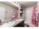 Bathroom with dual sinks, granite countertops, and shower-tub combination at 10 N Quantock St, Aurora, CO 80018