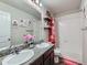 Bathroom featuring double sinks with granite countertop and tub with shower at 10 N Quantock St, Aurora, CO 80018