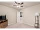Bright bedroom with a ceiling fan, neutral carpet, white trim and decor at 10 N Quantock St, Aurora, CO 80018