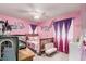 Whimsical pink bedroom with fun decor and plenty of space at 10 N Quantock St, Aurora, CO 80018