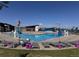 Community pool with slides, lifeguard station, and lounge chairs for relaxing by the water at 10 N Quantock St, Aurora, CO 80018