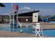 Community pool featuring a slide and splash area, surrounded by a modern pool house at 10 N Quantock St, Aurora, CO 80018