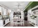 Dining area with a view into the kitchen, creating a seamless flow for entertaining at 10 N Quantock St, Aurora, CO 80018