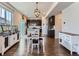 Open concept dining area features stylish lighting and easy access to kitchen and living spaces at 10 N Quantock St, Aurora, CO 80018