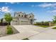 Charming two-story home featuring a three-car garage and a welcoming front porch at 10 N Quantock St, Aurora, CO 80018