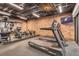 Well-equipped fitness center featuring state-of-the-art treadmills, weight machines, and mirrored walls at 10 N Quantock St, Aurora, CO 80018