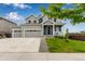 Beautiful home featuring a well-manicured lawn, three-car garage, and a charming front porch at 10 N Quantock St, Aurora, CO 80018