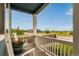 Relaxing front porch with white rocking chairs and a view of the neighborhood street at 10 N Quantock St, Aurora, CO 80018