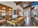 Spacious game room featuring a shuffleboard table and other entertainment options for residents to enjoy at 10 N Quantock St, Aurora, CO 80018