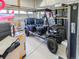 Garage featuring an open golf cart with blue and black seats at 10 N Quantock St, Aurora, CO 80018