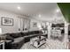 Open-concept living room boasts hardwood floors, modern decor, and a comfortable sectional sofa at 10 N Quantock St, Aurora, CO 80018