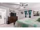 Comfortable main bedroom with ceiling fan, dresser and soothing colors at 10 N Quantock St, Aurora, CO 80018