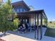 Stylish outdoor patio area with comfortable seating and a modern fireplace for relaxation and entertainment at 10 N Quantock St, Aurora, CO 80018