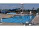 Community pool with slides, lounge area, and seating for a fun outdoor experience at 10 N Quantock St, Aurora, CO 80018