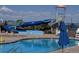 Community pool area with waterslide and lifeguard stand offering fun and safety at 10 N Quantock St, Aurora, CO 80018
