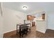 Cozy dining area with wooden floors and convenient access to the kitchen at 3400 S Eagle St # 104, Aurora, CO 80014
