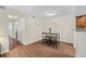 The dining area is adjacent to the kitchen and boasts stylish wood-look floors at 3400 S Eagle St # 104, Aurora, CO 80014
